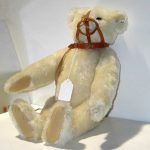 A Steiff 22-inch mohair bear White articulating limited edition (#1639) bear with growler