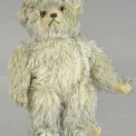 SQUEEZE CHEST MUSICAL TEDDY BEAR