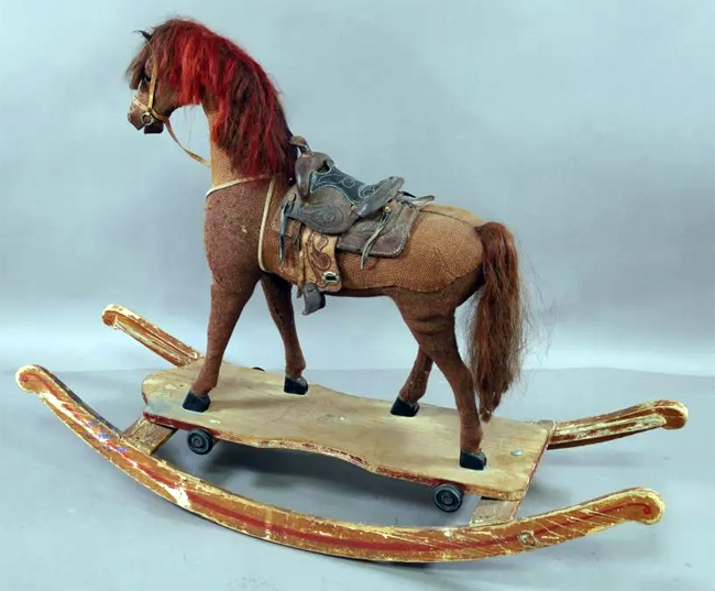 STRAW FILLED ROCKING HORSE WITH LEATHER SADDLE ON WOOD ROCKERS